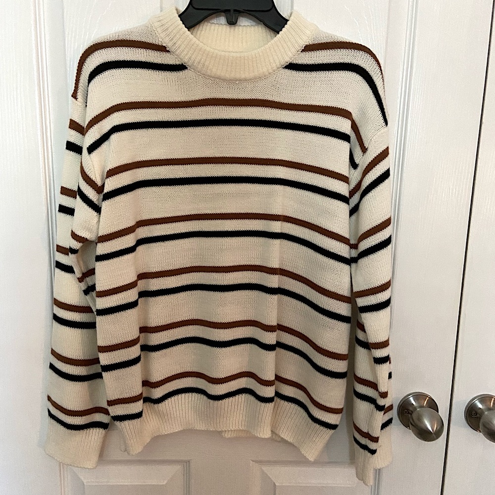 Size medium sweater, white with black and dark orange stripes.